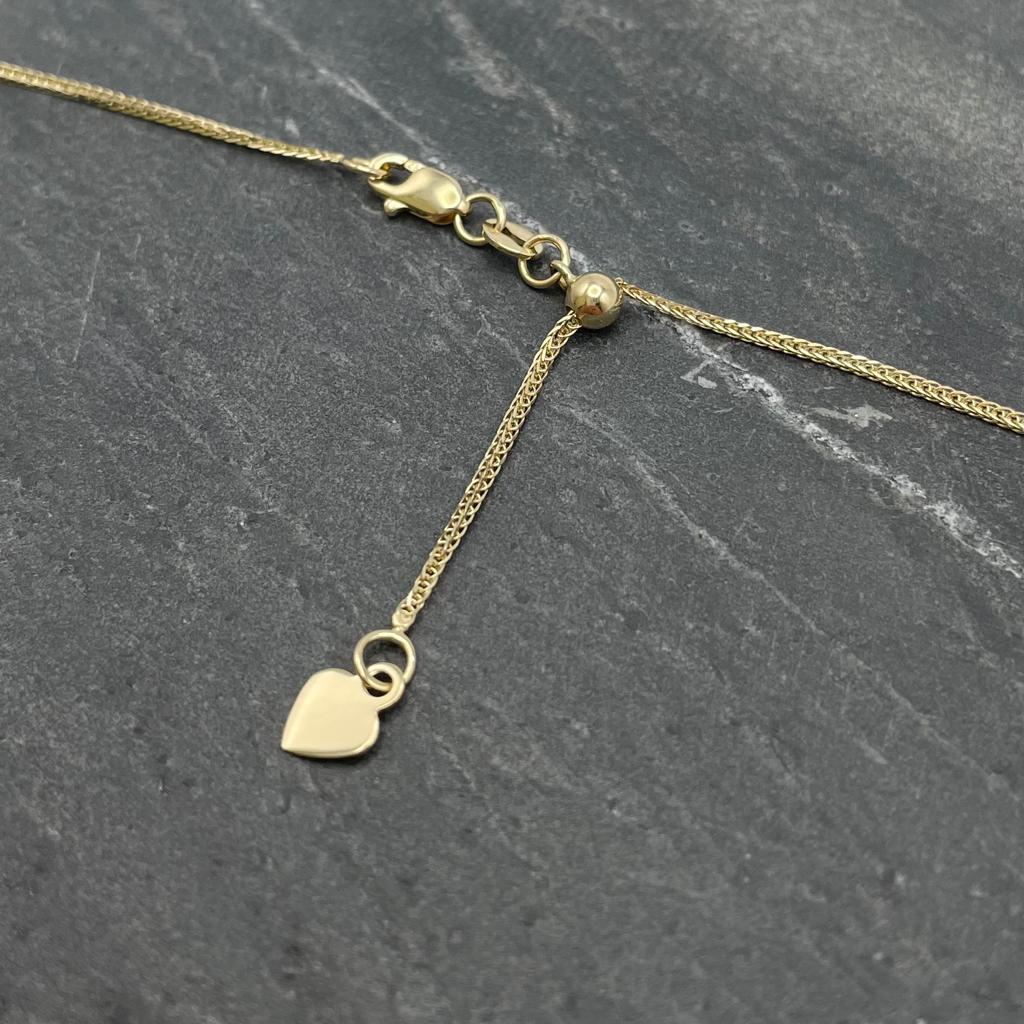 14K Yellow gold adjustable wheat necklace with a small heart charm on end and lobster clasp.