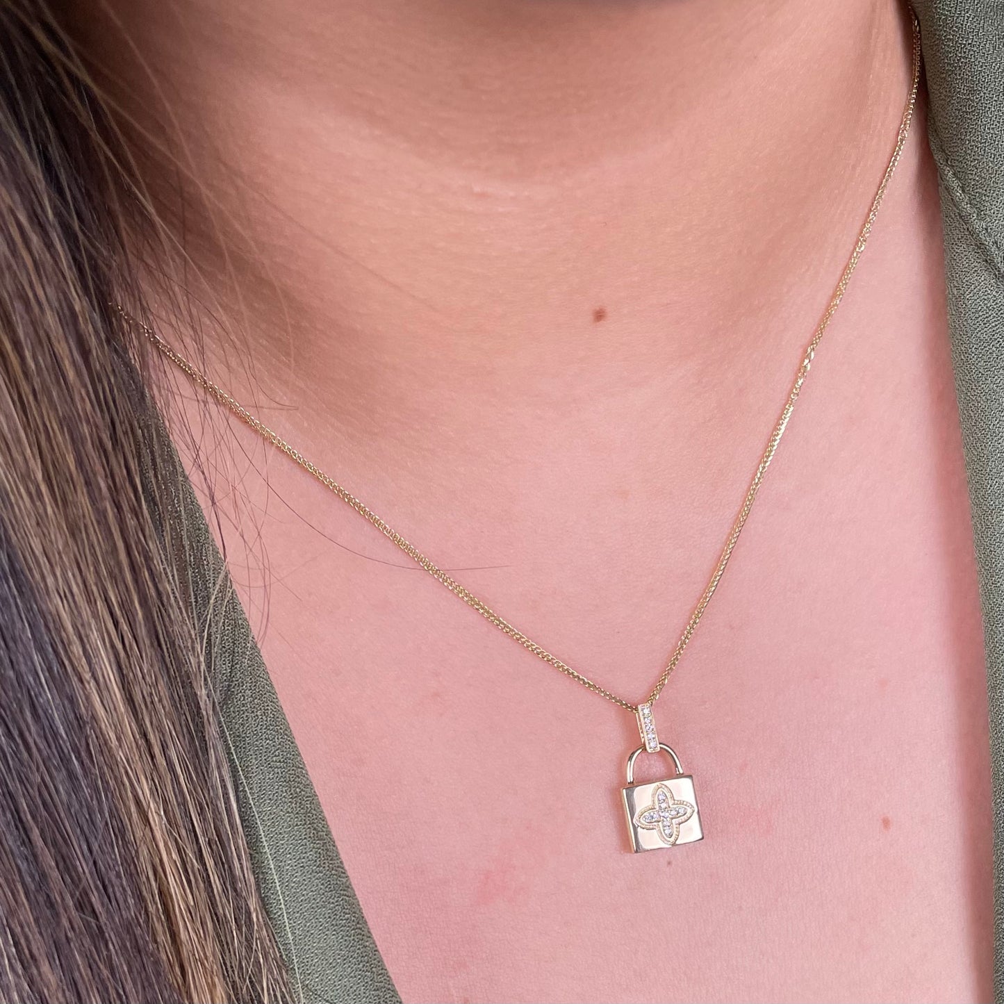 14K Yellow Gold lock pendant with Sim - Diamond encrusted blossom.